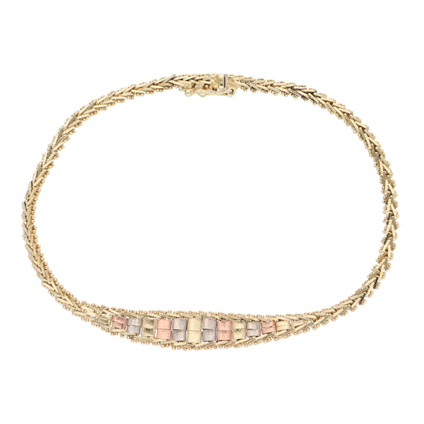 Pulsera boleada en oro tres tonos 14 kilates.