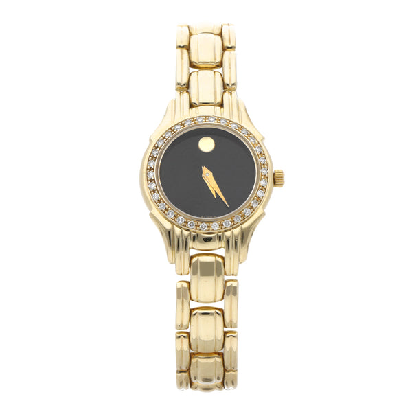 Reloj Movado para dama en oro amarillo 14 kilates.