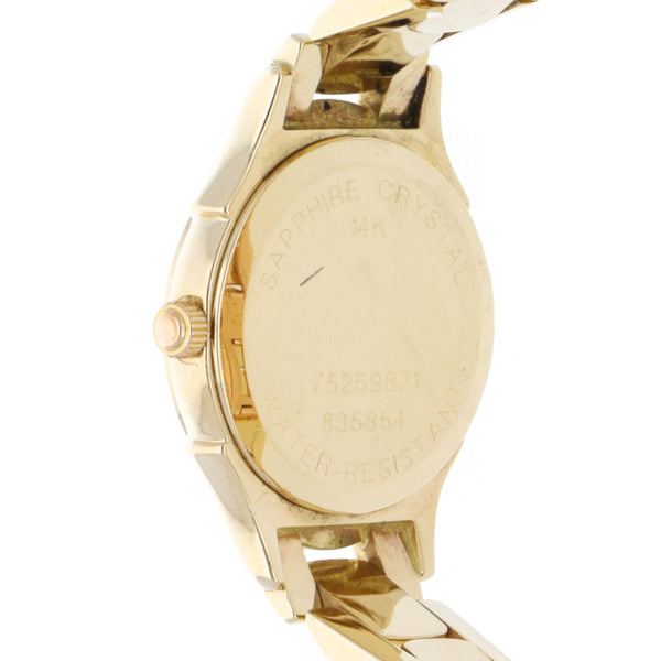 Reloj Movado para dama en oro amarillo 14 kilates.