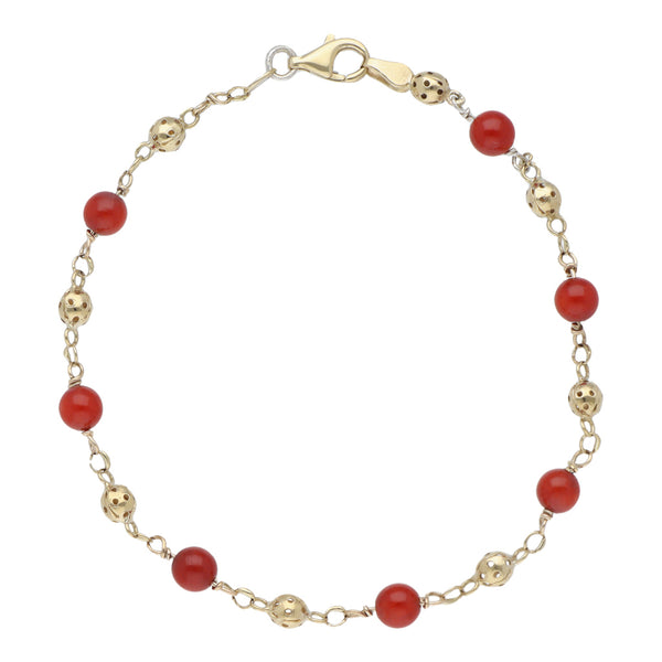 Pulsera eslabón combinado con coral en oro amarillo 14 kilates.