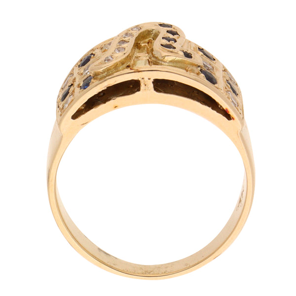 Anillo estilizado con diamantes y zafiros en oro amarillo 14 kilates.