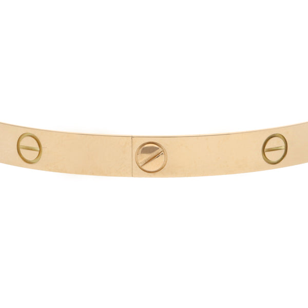 Pulsera de arillo articulada firma Cartier motivo tornillos simulados en oro amarillo 18 kilates.