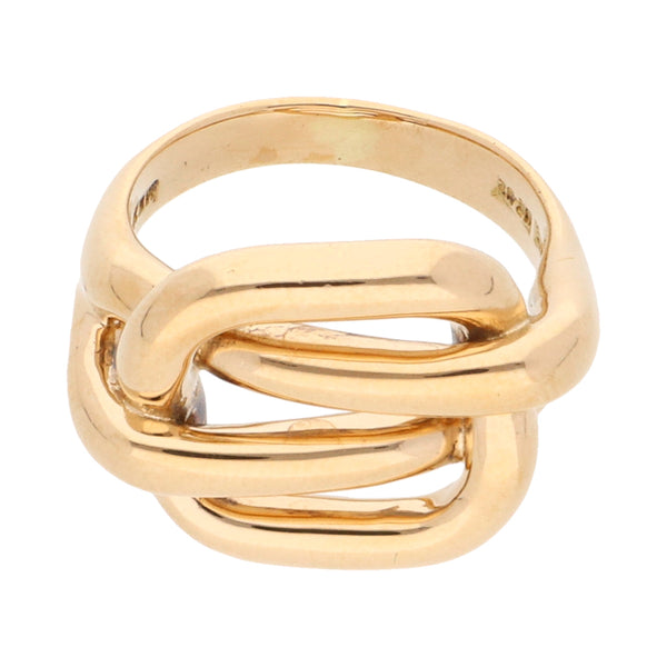 Anillo calado motivo nudo firma Tane en oro amarillo 18 kilates.