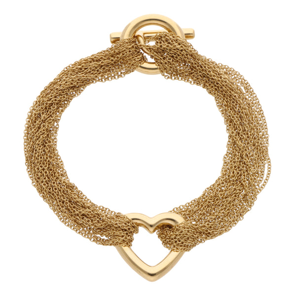 Pulsera eslabón cruzado en hilos motivo corazón firma Tiffany & Co. en oro amarillo 18 kilates.