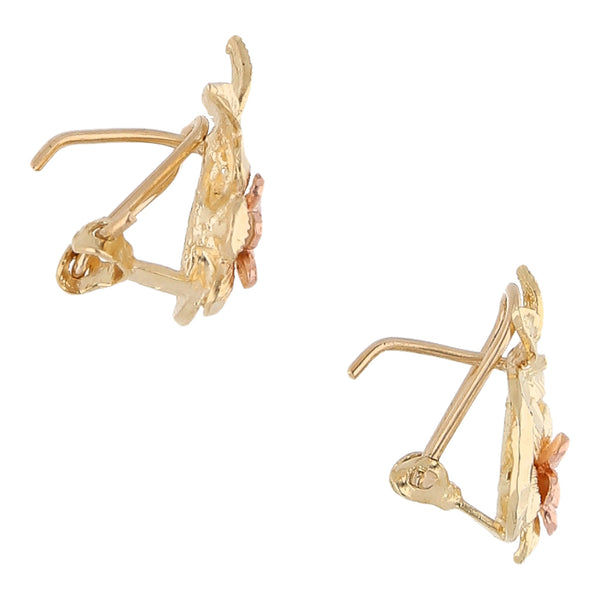 Aretes calados motivo floral en oro dos tonos 10 kilates.