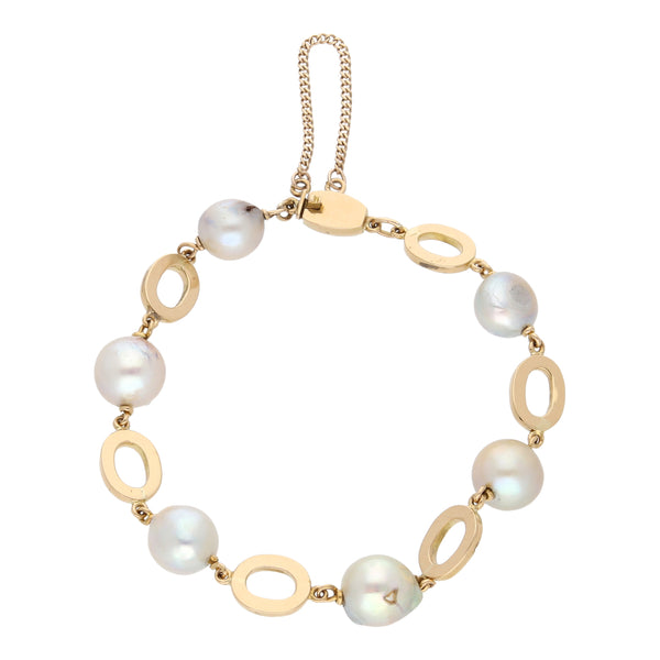 Pulsera eslabón combinado con perlas en oro amarillo 18 kilates.