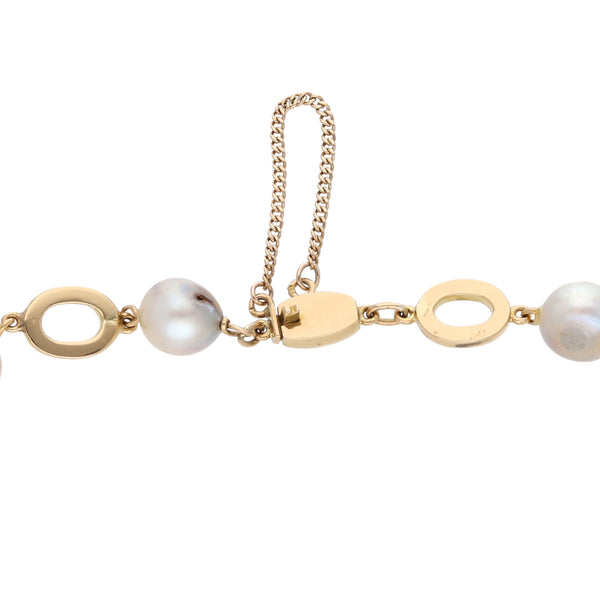 Pulsera eslabón combinado con perlas en oro amarillo 18 kilates.