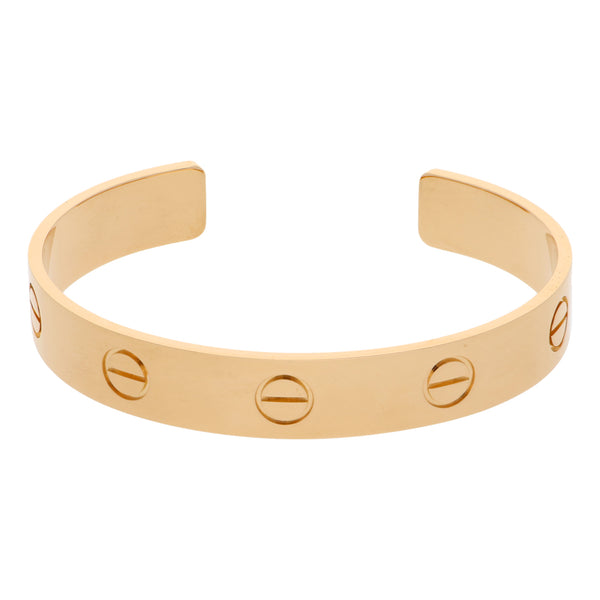 Pulsera abierta firma Cartier en oro amarillo 18 kilates.