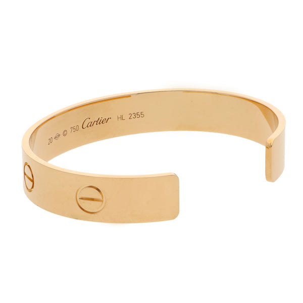 Pulsera abierta firma Cartier en oro amarillo 18 kilates.