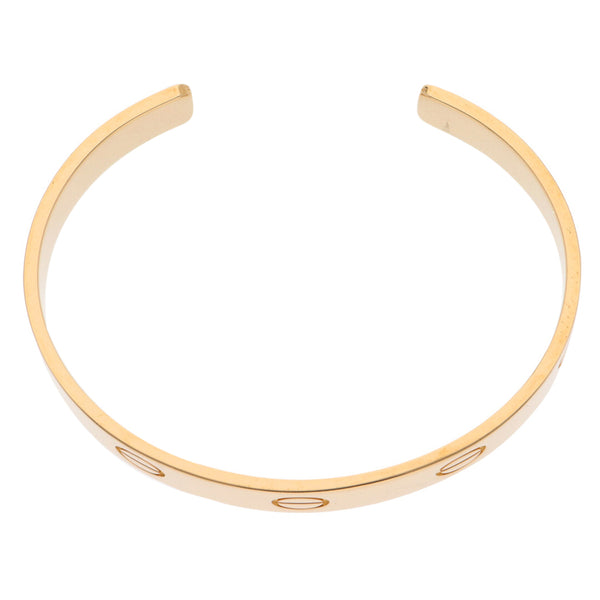 Pulsera abierta firma Cartier en oro amarillo 18 kilates.