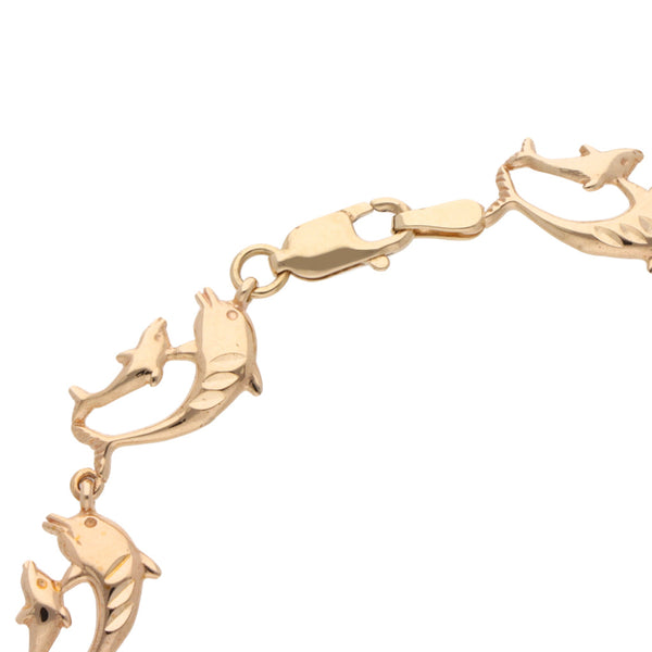 Pulsera eslabón articulado motivo delfines en oro amarillo 14 kilates.