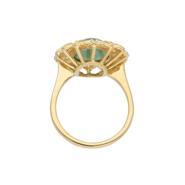 Anillo tipo sello motivo flor con sintético en oro amarillo 18 kilates.