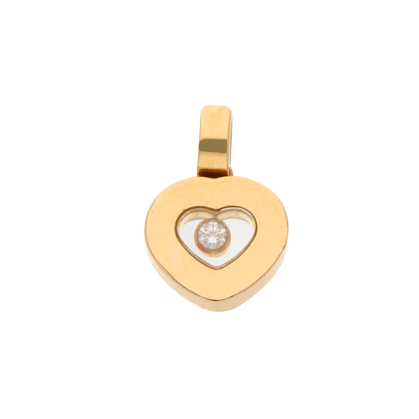 Dije diseño especial motivo corazón firma Chopard con diamante en oro amarillo 18 kilates.