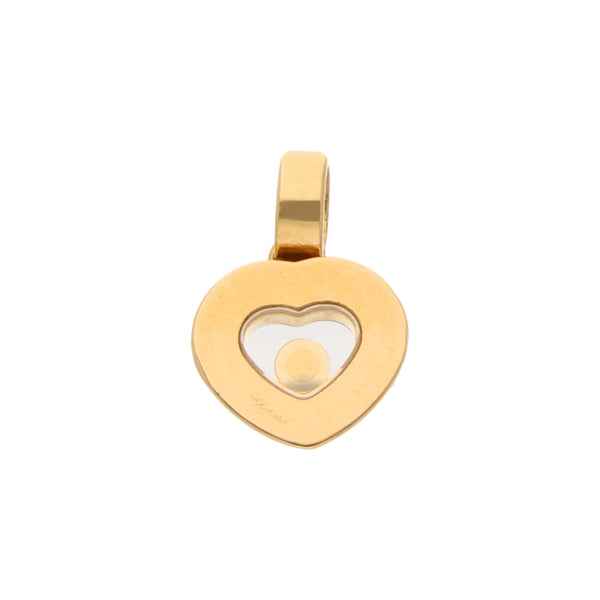 Dije diseño especial motivo corazón firma Chopard con diamante en oro amarillo 18 kilates.