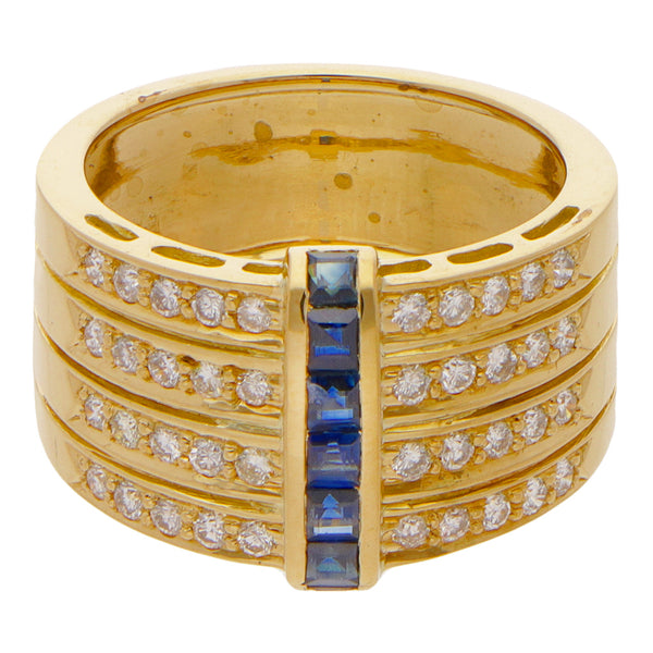 Anillo hechura especial con diamantes y zafiros en oro amarillo 18 kilates.
