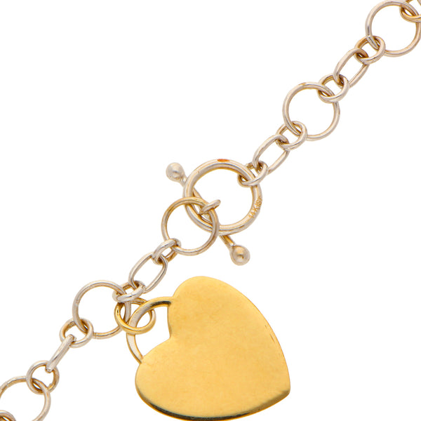 Juego de collar y dos pulseras eslabón uno por uno con pendientes motivo corazón en oro blanco 14 kilates.