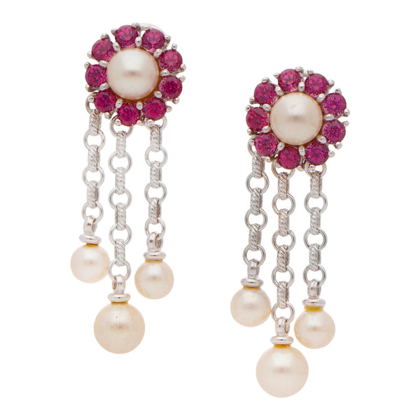 Aretes hechura especial con perlas y sintéticos firma Zancan en oro blanco 18 kilates.