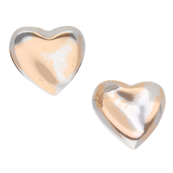 Aretes huecos motivo corazón en oro blanco 14 kilates.