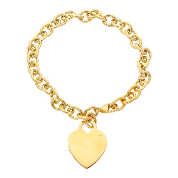 Pulsera eslabón cruzado con pendiente motivo corazón firma Tiffany & Co. en oro amarillo 18 kilates.