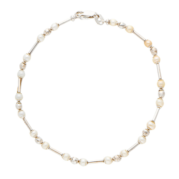 Pulsera hechura italiana con perlas en oro blanco 14 kilates.