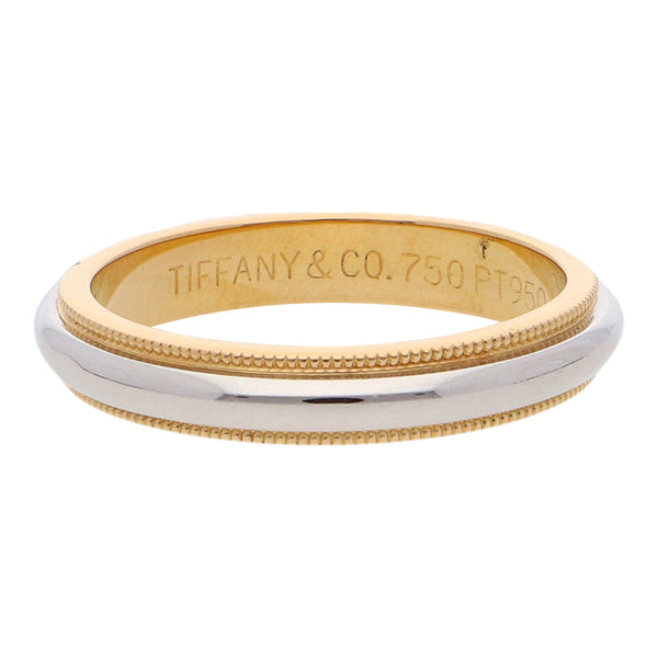 Argolla hechura especial firma Tiffany & Co. en platino y oro amarillo 18 kilates.