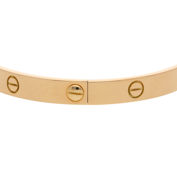 Brazalete articulado motivo tornillos simulados firma Cartier en oro amarillo 18 kilates.