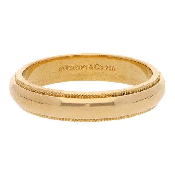 Argolla media caña firma Tiffany & Co. en oro amarillo 18 kilates.