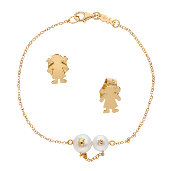 Juego de pulsera eslabón cruzado con perlas y diamante broqueles estilizados motivo niña en oro amarillo 18 kilates.