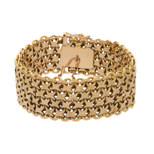 Pulsera eslabón palmeado en oro amarillo 18 kilates.