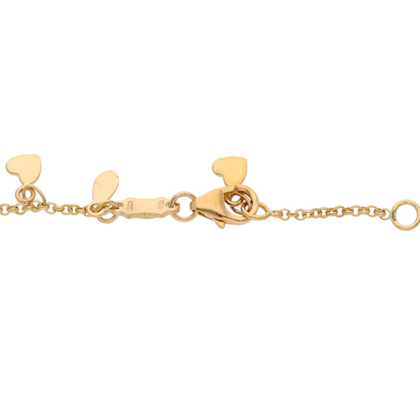 Pulsera eslabón cruzado motivo corazones en oro amarillo 18 kilates.