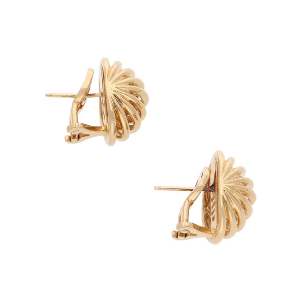 Aretes hechura especial firma Tane en oro amarillo 18 kilates.