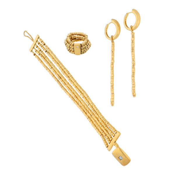 Juego de pulsera cinco hilos eslabón tubular, arracadas con colgantes y argolla articulada firma H.Stern con diamantes en oro amarillo 18 kilates.