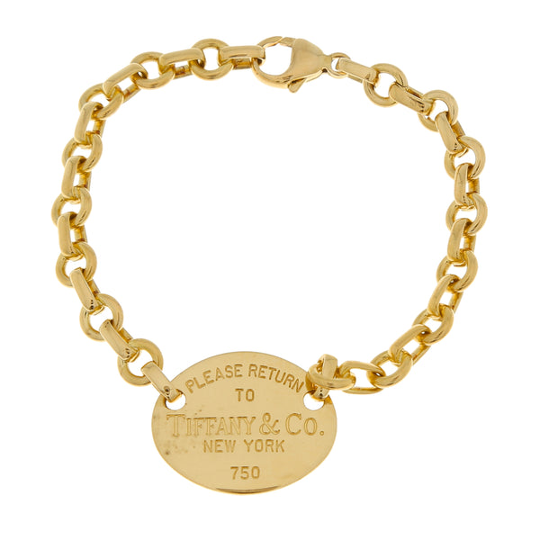 Juego de Gargantilla y pulsera eslabón cruzado firma Tiffany & Co. en oro amarillo 18 kilates.