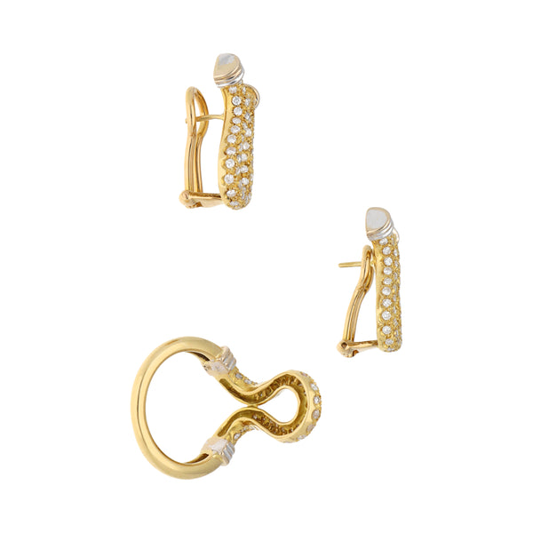 Juego de anillo y aretes diseño especial con diamantes en oro amarillo 18 kilates.