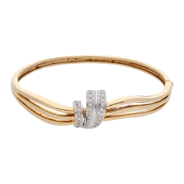 Pulsera de arillo articulada con diamantes en oro dos tonos 18 kilates.