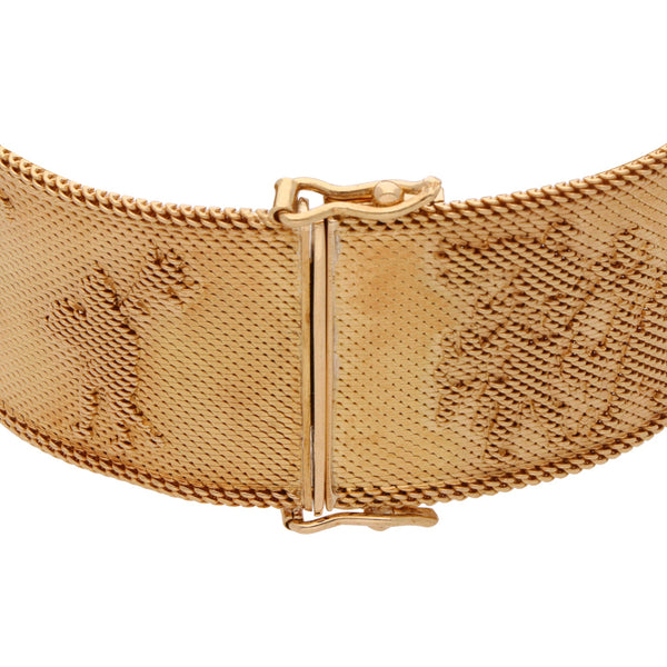 Brazalete eslabón tejido motivo prehispanico en oro amarillo 18 kilates.
