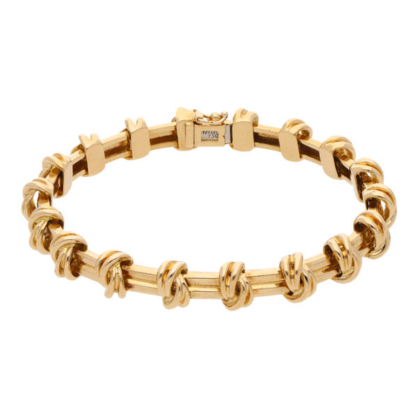 Pulsera articulada firma Tiffany & Co. en oro amarillo 18 kilates.