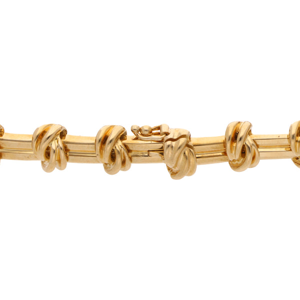 Pulsera articulada firma Tiffany & Co. en oro amarillo 18 kilates.