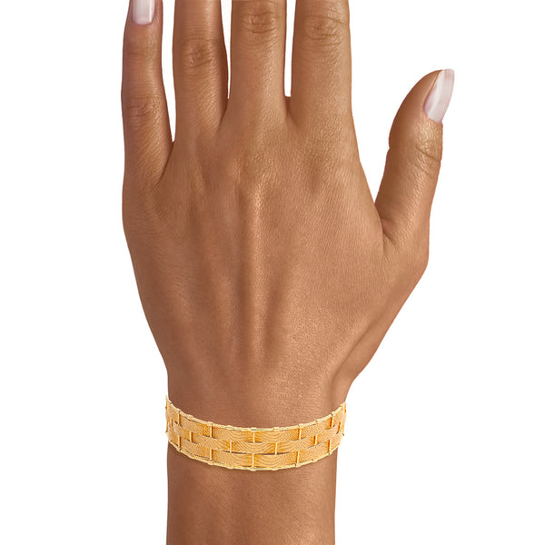 Brazalete abierto en oro amarillo 14 kilates.