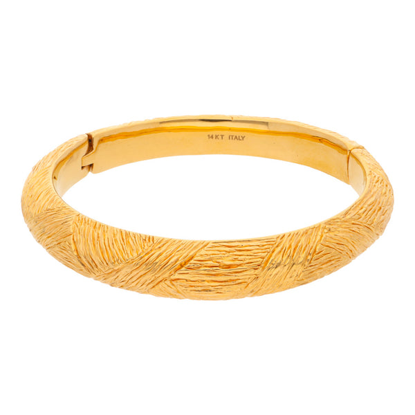 Pulsera hueca articulada en oro amarillo 14 kilates.