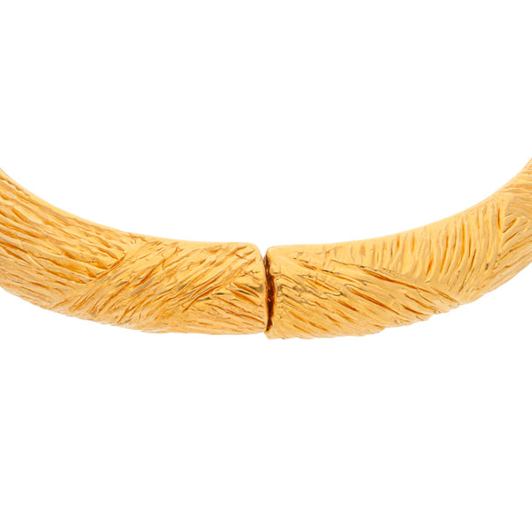 Pulsera hueca articulada en oro amarillo 14 kilates.