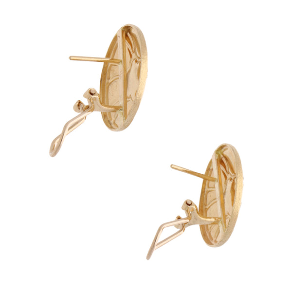 Aretes hechura especial en oro tres tonos 14 kilates.