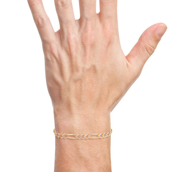 Pulsera de tres eslabones por uno diamantados en oro amarillo 14 kilates.