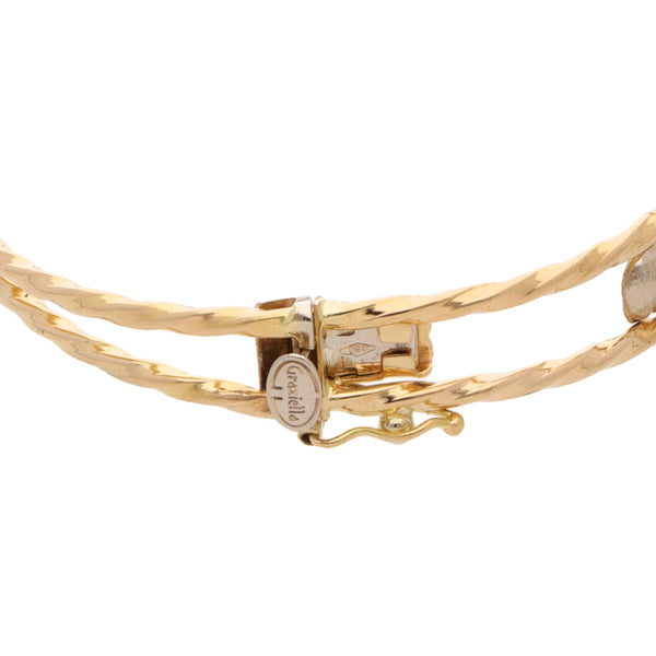 Pulsera articulada torzal dos hilos motivo elefantes en oro tres tonos 18 kilates.