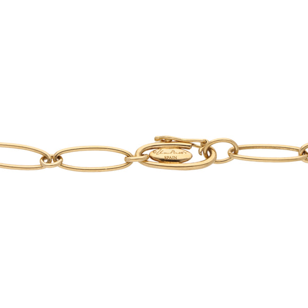 Pulsera eslabón ovalado con dije motivo estrella firma Tiffany & Co. en oro amarillo 18 kilates.