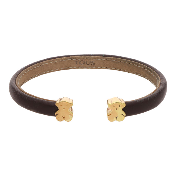 Pulsera abierta en piel firma Tous con aplicaciones motivo oso en oro amarillo 18 kilates.