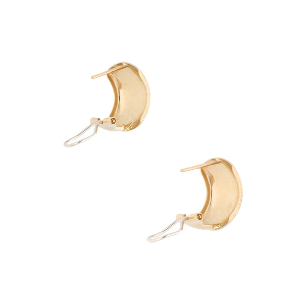 Aretes hechura especial en oro dos tonos 14 kilates.