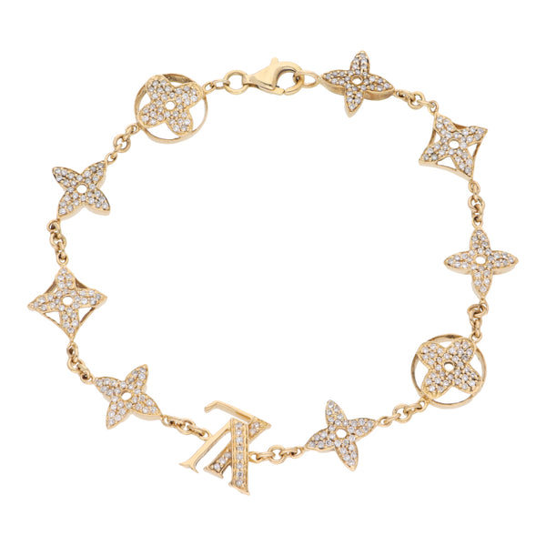 Pulsera eslabón combinado con sintéticos en oro amarillo 18 kilates.