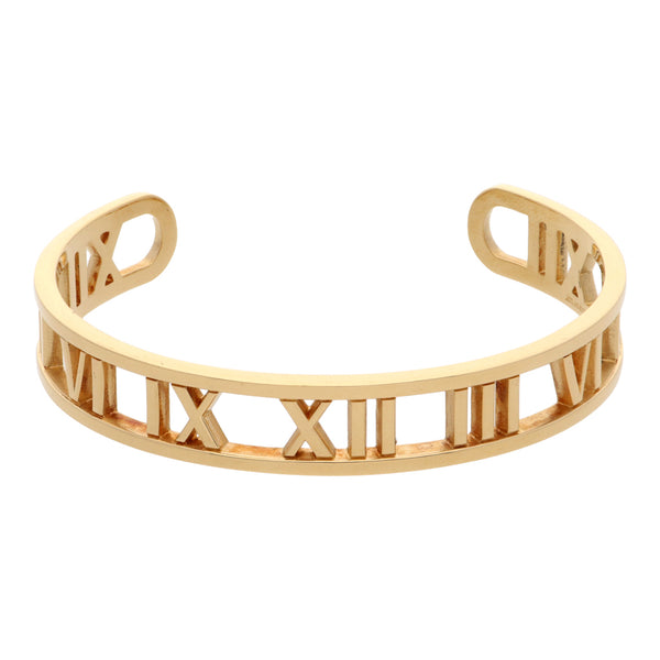 Pulsera abierta calada motivo números romanos firma Tiffany & Co. colección Atlas en oro amarillo 18 kilates.