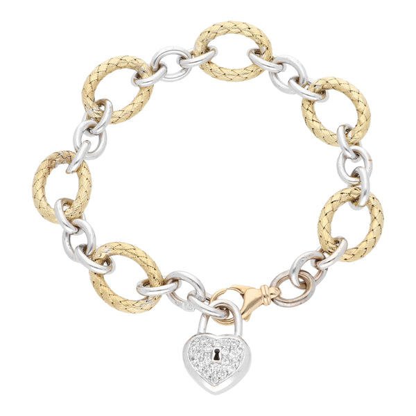 Pulsera eslabón combinado con dije motivo corazón y sintéticos en oro dos tonos 14 kilates.